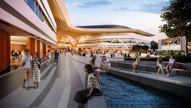 Melbourne cultural capital: Modern architecture and open plaza outside a Melbourne convention center with people walking, sitting, and enjoying the urban water feature at sunset