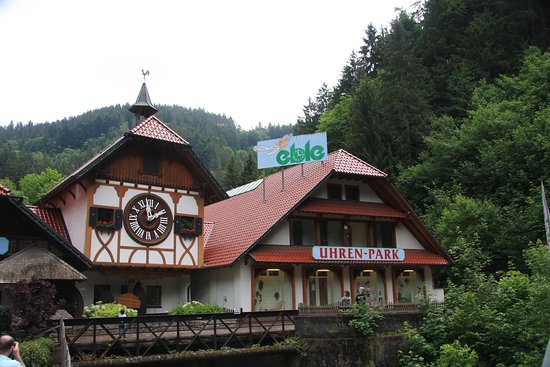 "Traditional Black Forest-style building at Uhren-Park in Triberg, Germany, featuring the world’s largest cuckoo clock surrounded by dense forest"