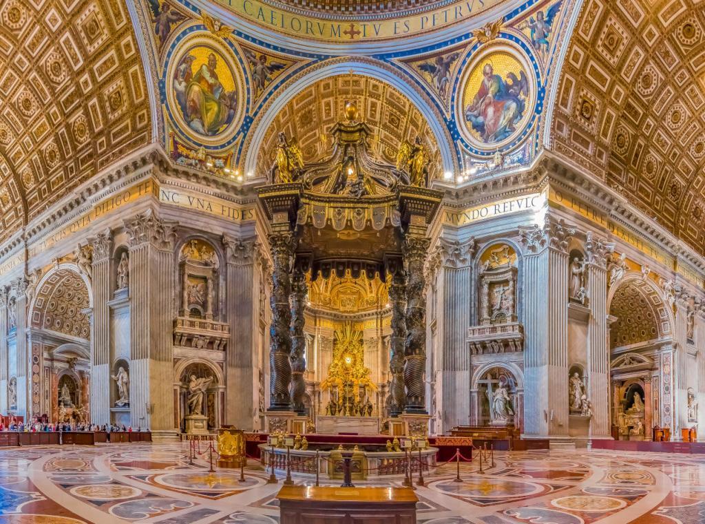 "Interior of St. Peter’s Basilica in Vatican City showcasing Bernini’s Baldachin, ornate marble columns, golden mosaics, and Renaissance artwork under the grand dome"