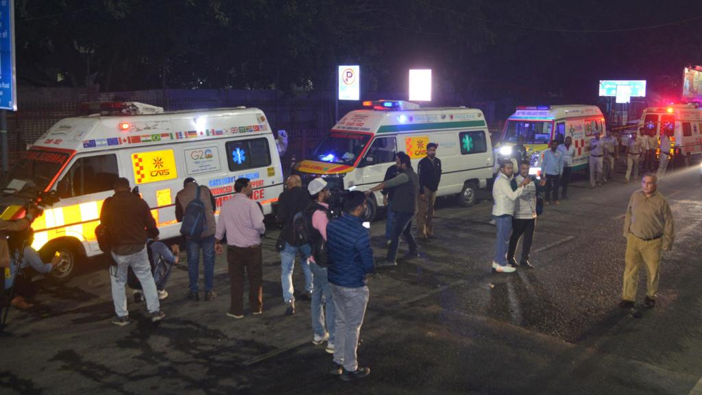 Ambulances and emergency responders at the scene near Delhi Red Fort blast: Delhi’s Red Fort following a powerful car explosion; police, media personnel, and rescue teams gather to manage the situation at night.