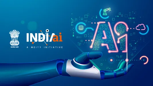 “Illustration of IndiaAI, a MeitY initiative, showing a robotic hand holding glowing AI text with digital icons representing artificial intelligence and technology innovation in India.”