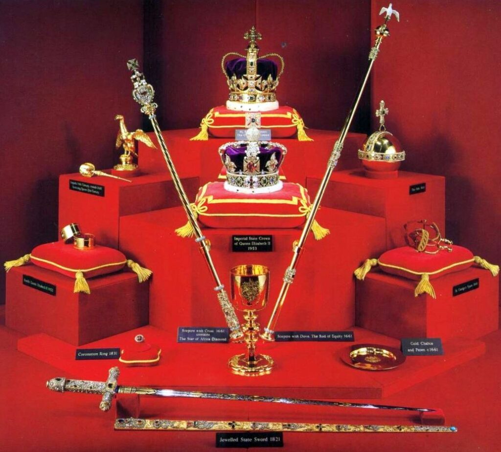 The Tower of London: "Display of the British Crown Jewels inside the Tower of London, featuring royal crowns, sceptres, swords, and gold ornaments used in coronation ceremonies"